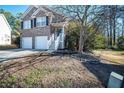 Two-story house with a two-car garage and steps leading to the front door at 2770 Stony Place Ct, Grayson, GA 30017