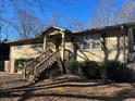 Ranch home featuring a covered entryway and landscaping at 3873 Sandy Plains Rd, Marietta, GA 30066