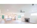 Spacious living room with hardwood floors, a fireplace, and large windows at 2626 Radvell Ct, Decatur, GA 30034