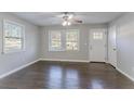 Bright living room with dark hardwood floors and neutral walls at 3578 Adkins Nw Rd, Atlanta, GA 30331