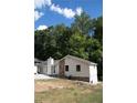 House with stone accents and a wooded backdrop at 3742 Tree Bark Ln, Snellville, GA 30039