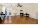 Living room with hardwood floors, fireplace, and French doors at 97 Bridge View Dr, Marietta, GA 30066