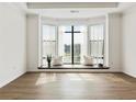 Spacious living room with a bay window and hardwood floors at 400 17Th Nw St # 2419, Atlanta, GA 30363