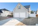 A two-car garage of a two-story home with neutral siding and a well-maintained lawn at 7492 Ferrara Dr, Lithonia, GA 30058