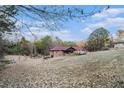House sits on a large lot with a wooded area at 4055 Thaxton Rd, Atlanta, GA 30349