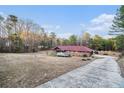 Ranch house with a long driveway and boat storage at 4055 Thaxton Rd, Atlanta, GA 30349