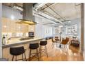 Stylish kitchen with stainless steel appliances, island seating, and an open view to the living area at 1058 Piedmont Ne Ave # 302, Atlanta, GA 30309