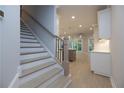 Modern staircase with light wood treads and black metal railing at 131 Wards Crossing Way # 19, Johns Creek, GA 30022