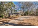 Brick ranch house with covered porch and large yard at 143 Longview Rd, Fayetteville, GA 30214