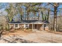 Brick ranch house with covered porch and large yard at 143 Longview Rd, Fayetteville, GA 30214