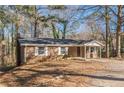 Brick ranch house with covered porch and large yard at 143 Longview Rd, Fayetteville, GA 30214