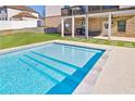 Inviting, rectangular pool with tiled steps and a large patio area at 4973 Concert Ln, Marietta, GA 30066