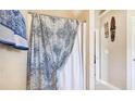 Bathroom with shower/tub combo and patterned shower curtain at 709 Chapman St, Jonesboro, GA 30238