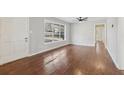 Bright and airy living room featuring hardwood floors and a large window at 1120 Starline Se Dr, Smyrna, GA 30080