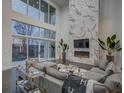 Spacious living room featuring a marble fireplace and large windows at 55 Serendipity Way, Atlanta, GA 30350