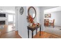 Bright entryway with hardwood floors, console table, and views into adjacent rooms at 2618 Windage Sw Dr, Marietta, GA 30008