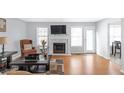 Living room with hardwood floors, fireplace, and plenty of natural light at 2618 Windage Sw Dr, Marietta, GA 30008