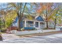 Charming blue house with white trim, front porch, and landscaped yard at 516 Arthur Sw St, Atlanta, GA 30310