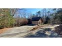 Long driveway leading to a brick house at 1030 Lake Haynes Ne Dr, Conyers, GA 30012
