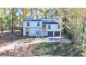 Two-story house, two-car garage, basketball court, and wooded setting at 2490 Woodfern Ct, Marietta, GA 30062