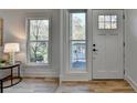 Bright entryway with hardwood floors, and white door at 2490 Woodfern Ct, Marietta, GA 30062
