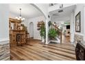 Elegant entryway with a built-in bar, hardwood floors and plant accents at 7108 Roselake Cir, Douglasville, GA 30134