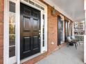 Elegant black front door with white trim and sidelights at 2750 Olde Towne Pkwy, Duluth, GA 30097