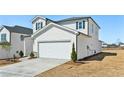 Beautiful home with a two-car garage, gray roof, and manicured landscaping at 2026 Avalon Rdg, Conyers, GA 30013