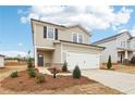 Traditional home with a two-car garage, tidy landscaping, and a welcoming front entrance at 2028 Avalon Rdg, Conyers, GA 30013
