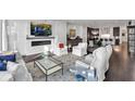 Spacious living room with marble fireplace and open floor plan at 1301 Peachtree # 3B, Atlanta, GA 30309