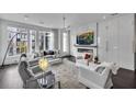 Open living area with fireplace, large windows, and ample seating at 1301 Peachtree # 3B, Atlanta, GA 30309