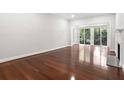 Bright living room with hardwood floors and a fireplace at 2921 Lenox Ne Rd # 201, Atlanta, GA 30324