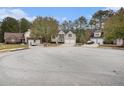 Houses in a cul-de-sac with a large paved area in the center at 6876 Wildboar Dr, Fairburn, GA 30213