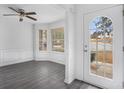 Bright dining room with bay window and gray vinyl flooring at 6876 Wildboar Dr, Fairburn, GA 30213