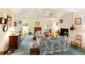 Living room with floral sofas, fireplace, and wood-beamed ceiling at 7470 Princeton Trce, Sandy Springs, GA 30328