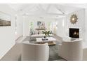Bright living room with white walls, fireplace, and comfy seating at 7470 Princeton Trce, Sandy Springs, GA 30328