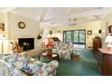 Spacious living room with a fireplace and access to a deck at 7470 Princeton Trce, Sandy Springs, GA 30328