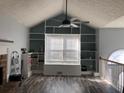 Spacious living room with built-in shelving and hardwood floors at 114 Muirwood Dr, Temple, GA 30179