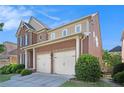 Brick home with 2-car garage and well-maintained landscaping in a suburban neighborhood at 4685 Prater Se Way, Smyrna, GA 30080