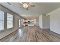 Open living room with hardwood floors and kitchen view at 57 Longhorn Way, Auburn, GA 30011