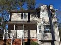 Tan two-story house with white trim and a small front porch at 3725 Linwood Way, Snellville, GA 30039
