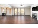 Spacious living room featuring hardwood floors and a fireplace at 6094 Whitetail Deer Run, Mableton, GA 30126