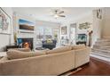 Open living area with sectional sofa, fireplace, and hardwood floors at 2367 Millhaven Se St # 15, Smyrna, GA 30080
