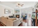 Spacious living room with fireplace, hardwood floors, and access to deck at 2367 Millhaven Se St # 15, Smyrna, GA 30080