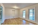Dining room featuring hardwood floors and built-in shelving at 4129 Shorter Way, Decatur, GA 30034