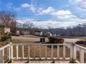 View from the porch shows a residential street and houses at 1110 1St Nw St, Atlanta, GA 30318