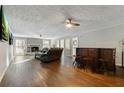 Spacious living room with hardwood floors, fireplace, and bar area at 4522 Karron Ln, Powder Springs, GA 30127