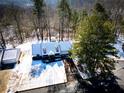 House nestled in wooded neighborhood, snow covered at 95 Brandon Dr, Covington, GA 30016
