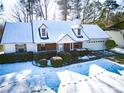 Charming house with snow-covered roof and yard at 95 Brandon Dr, Covington, GA 30016