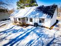 Rear view of house showcasing patio and yard at 95 Brandon Dr, Covington, GA 30016